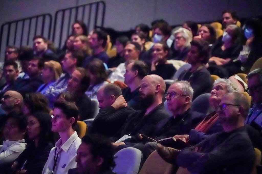 people sitting watching presentation