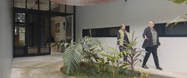 female architects walking in outdoor courtyard